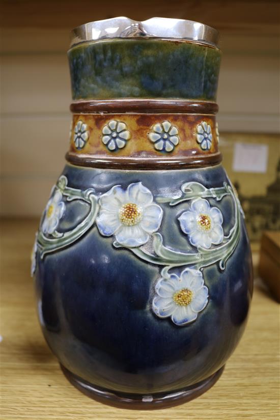 A Royal Doulton stoneware inkwell, The Virago, designed by Leslie Harradine and a Doulton silver-mounted jug,